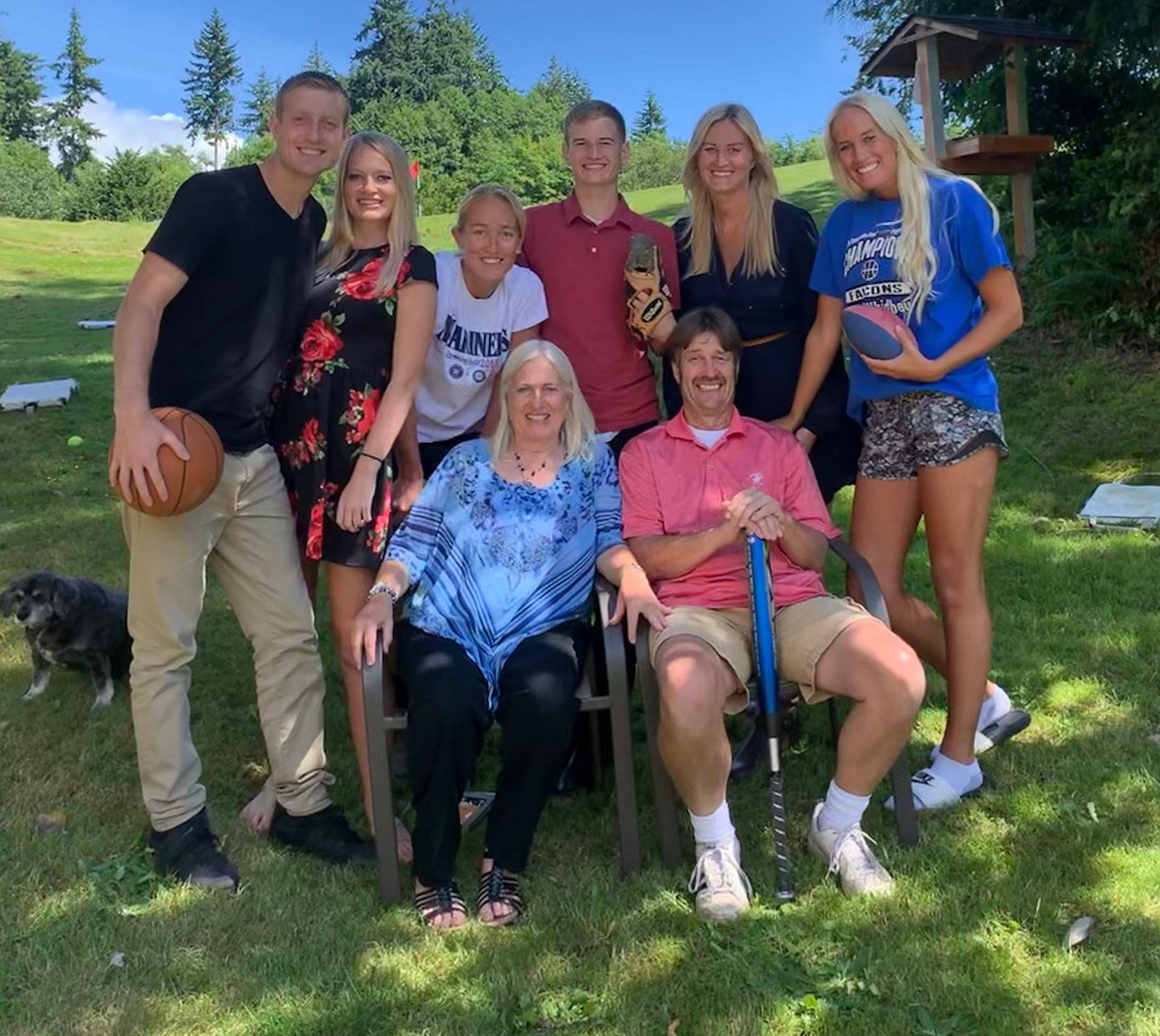 Provided photo                                The Newman family, with sports gear in hand, gather at Kody’s graduation party June 8. Riley (left), Carlie, Lindsey, Kody, Caite and Haley huddle around parents Pam and Mike. Jenny lives in Texas and could not attend.