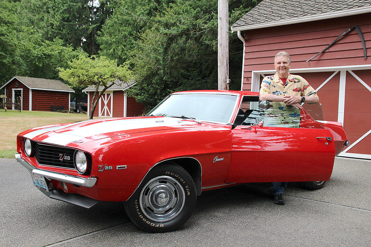 Ray Harding stands with 1969 Chevrolet Camaro Z/28, which will appear in the car show Sunday. (Photos by Laura Guido/South Whidbey Record)