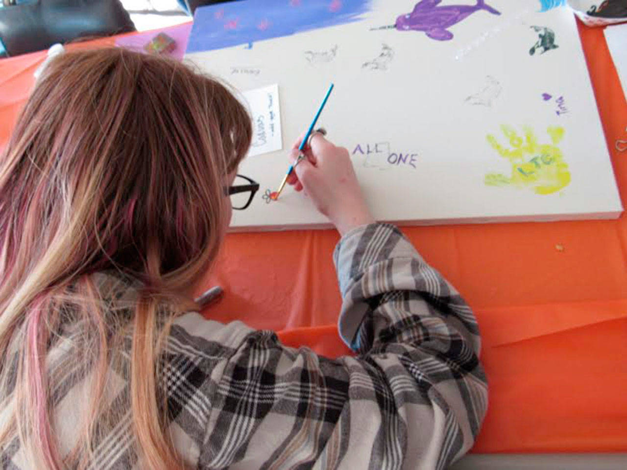 Picnic attendees created a community art canvas. (Photos provided)
