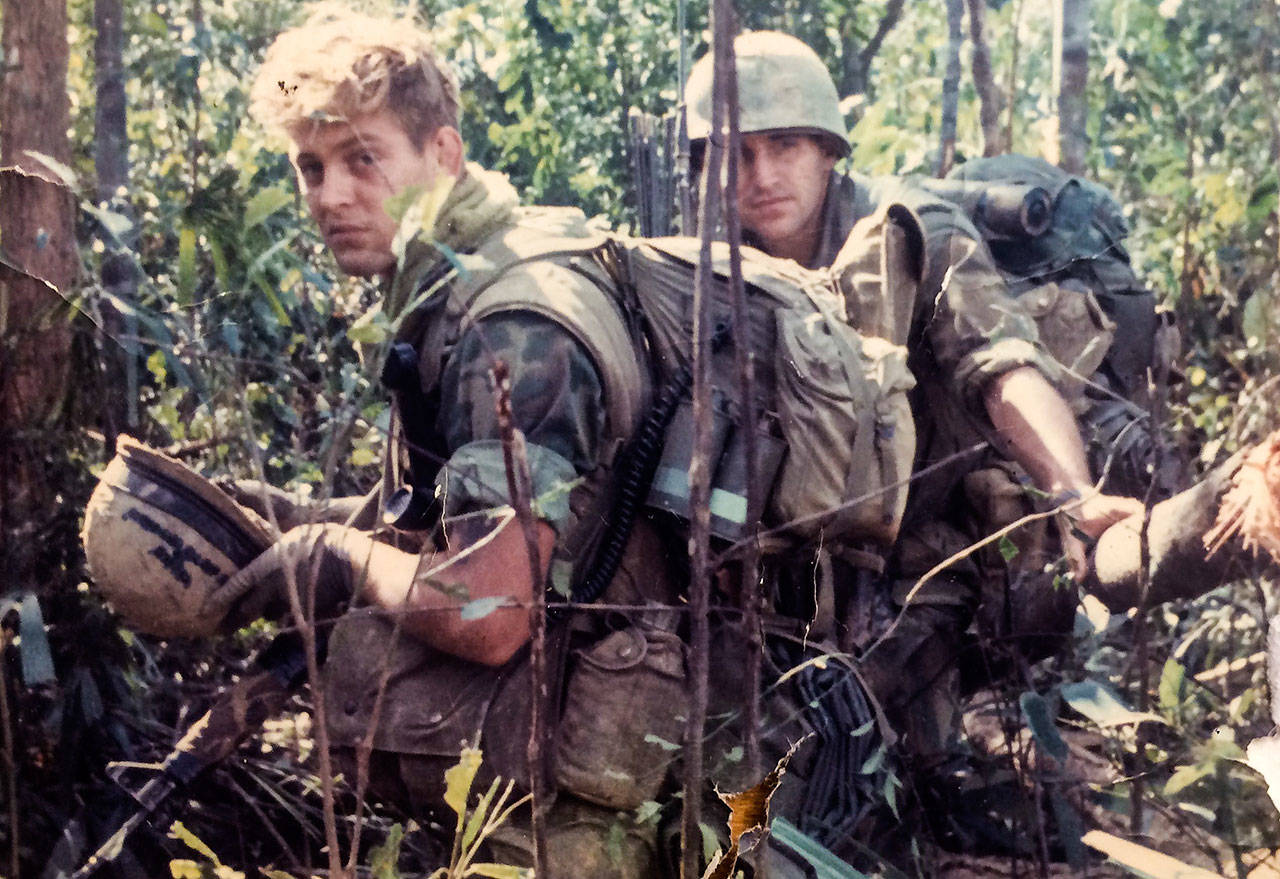 Jim Thompson (left) and the Marines of Charlie Company spent weeks at a time “out in the bush” searching for the enemy, the North Vietnamese Army. (Family photo)