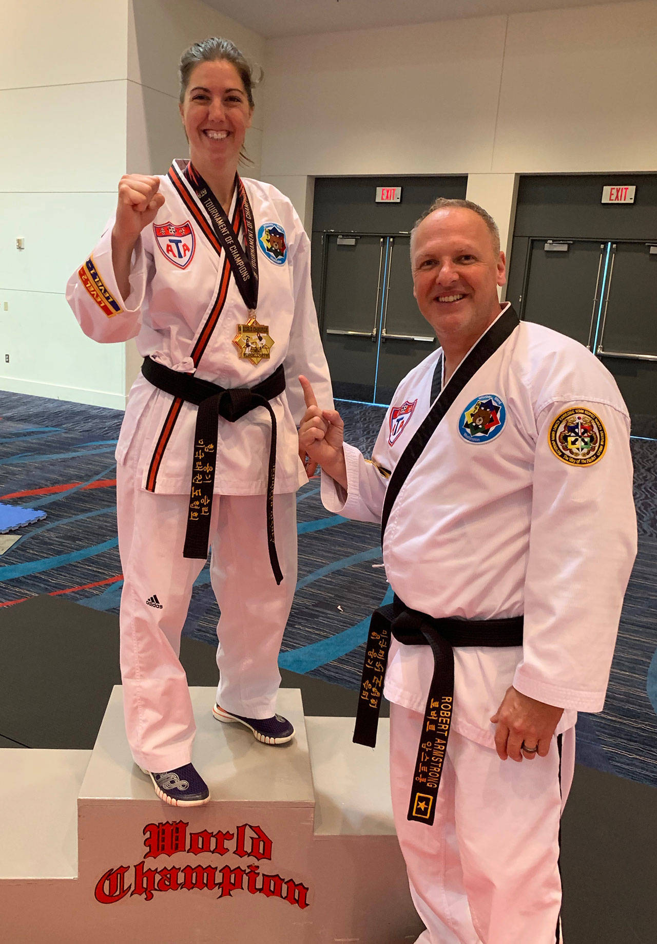 Jenny Cisney is joined by her lead instructor Robert Armstrong at the world championships. (submitted photo)