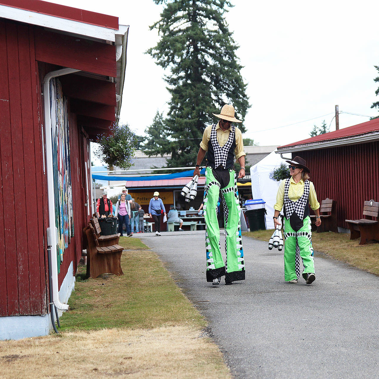Juggling duo Wren Schultz, left, and Della Moustachella take a stroll Thursday at the Whidbey Island Fair. Photos by Laura Guido/Whidbey News Group
