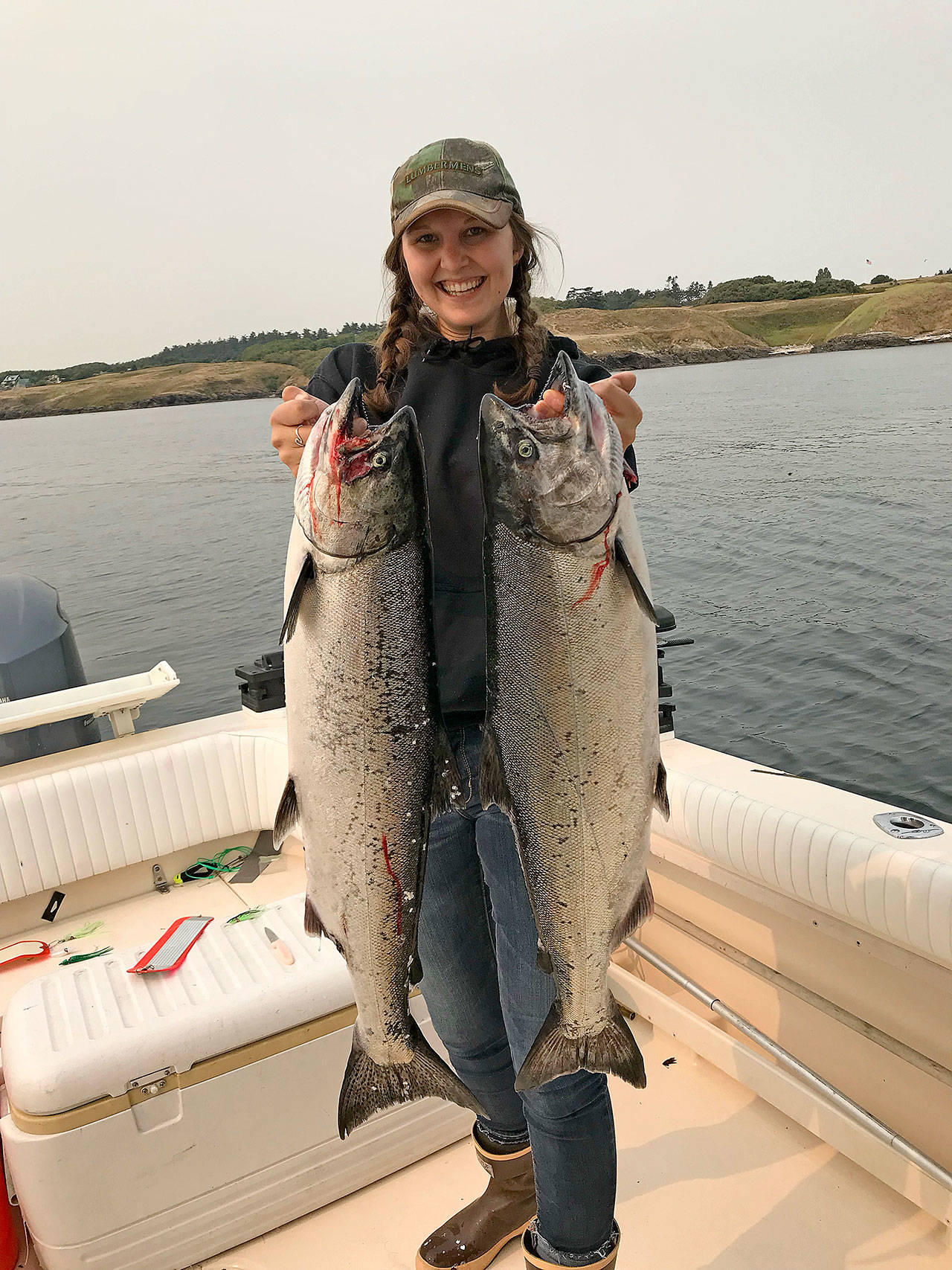Kelsey Miranda shows off two salmon she caught last year. Photo provided