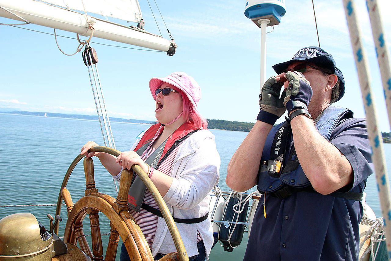 Dagne Shellenberg and Capt. Gary McIntyre shout at the crew to ready the schooner SUVA to come about.