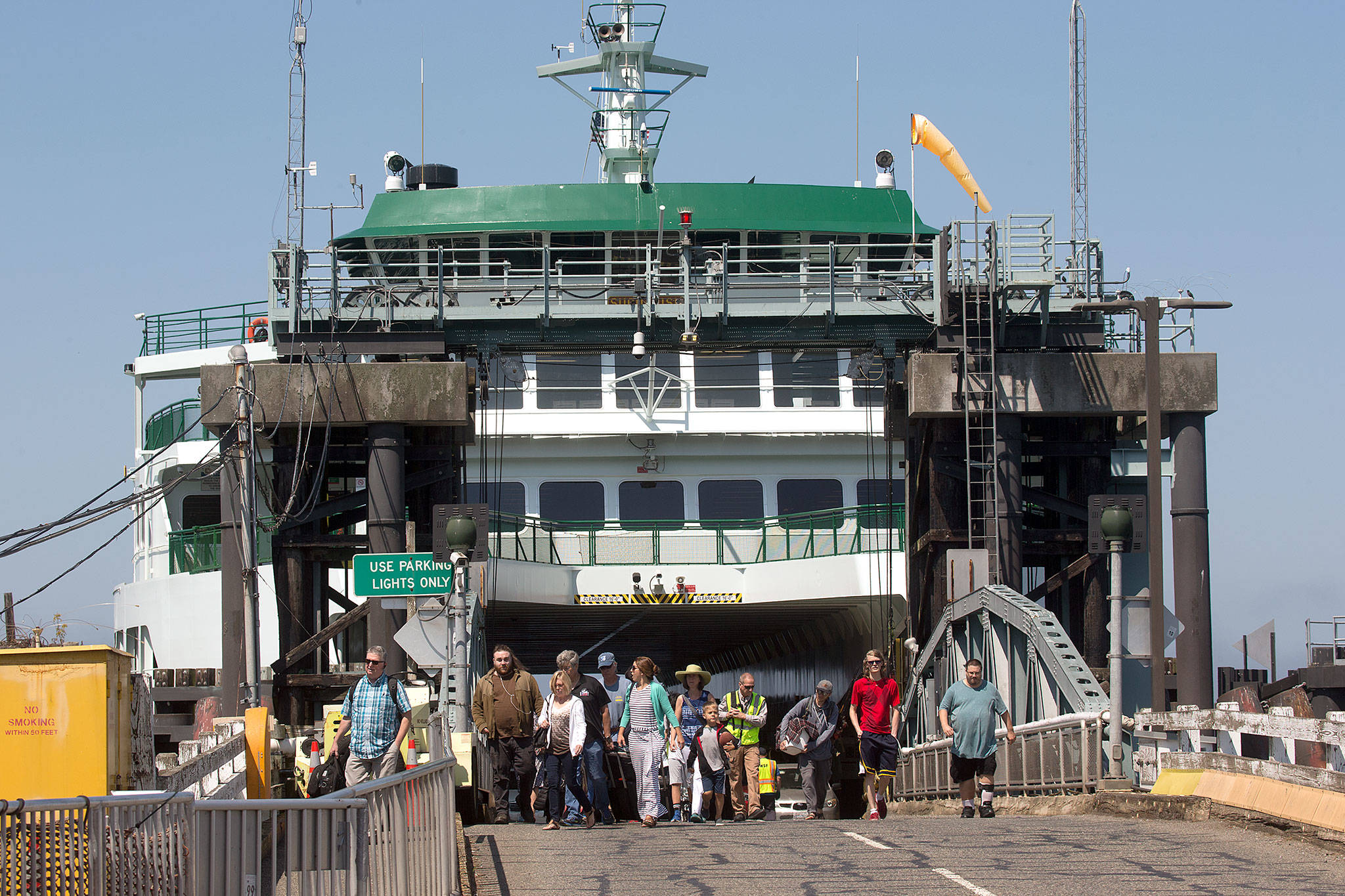 Walk-on passengers disembark from the ferry Suquamish at the Mukilteo ferry dock on Tuesday. The Washington State Transportation Commissioners has approved all of the proposed ferry rate increases for passengers and cars. (Andy Bronson / The Herald )
