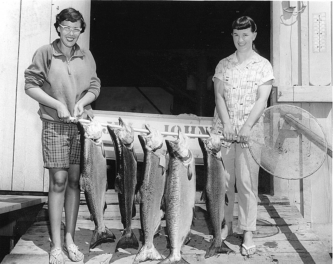 Jeannette Copper and Elizabeth Johnson show off the salmon catch at Jim and John’s Resort. Photo provided