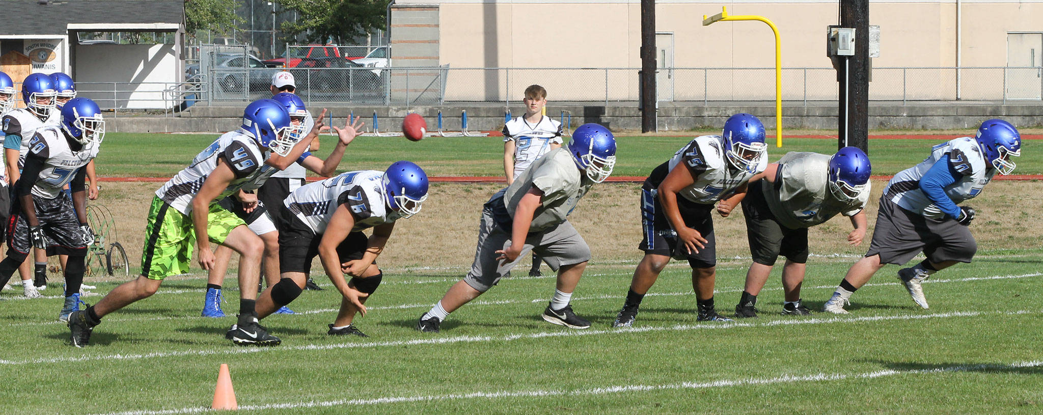The South Whidbey High School offense runs a play at practice Thursday. (Photo by Jim Waller/South Whidbey Record)
