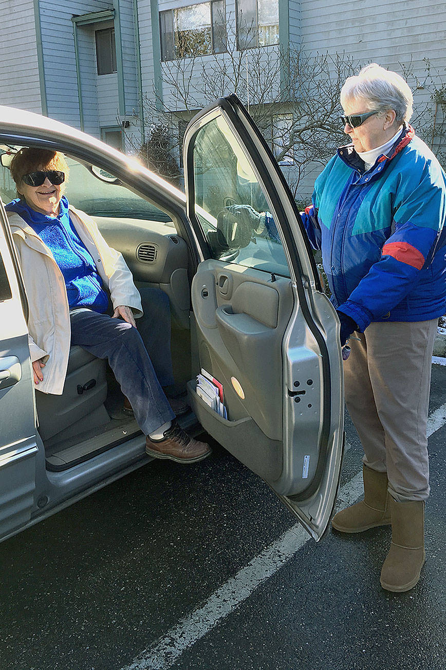 Client Jackie Milligan, left, and driver Millie Leengran, right, participate in the Medical Transportation program at Island Senior Resources. Photo courtesy of Island Senior Services