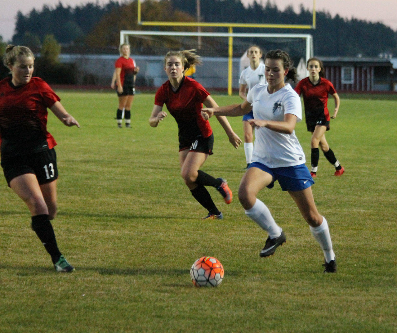 Alison Papritz (white jersey), the Falcons’ leading scorer, returns for the 2019 season. (Photo by Jim Waller/South Whidbey Record).