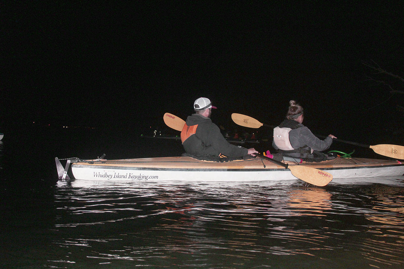 Kayakers glide from Langley Harbor on bioluminescent adventure in Saratoga Passage. Photo by Wendy Leigh/South Whidbey Record