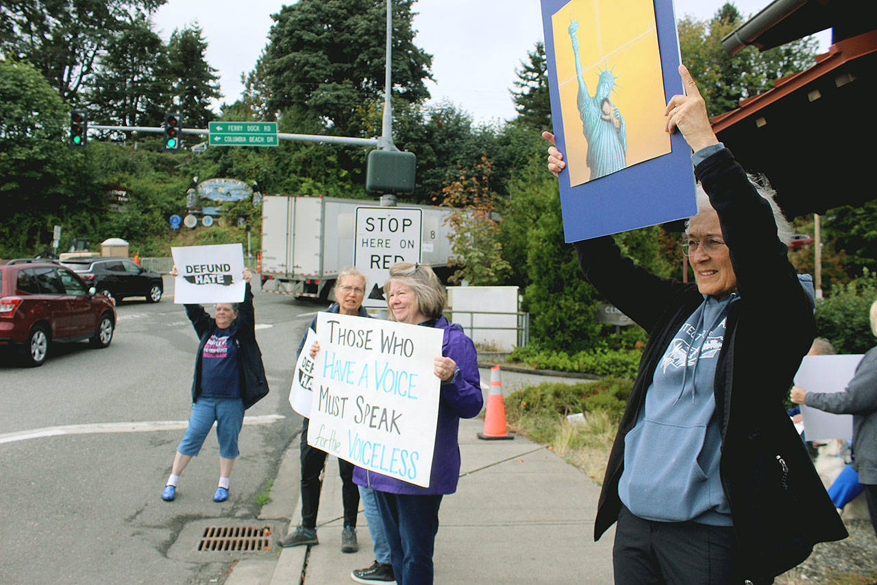 Members of Indivisible Whidbey group join a protest to “Defund Hate” and welcome the “Border to Border with Love” banner on its way to the Mexican border in San Diego. Photo by Wendy Leigh/South Whidbey Record