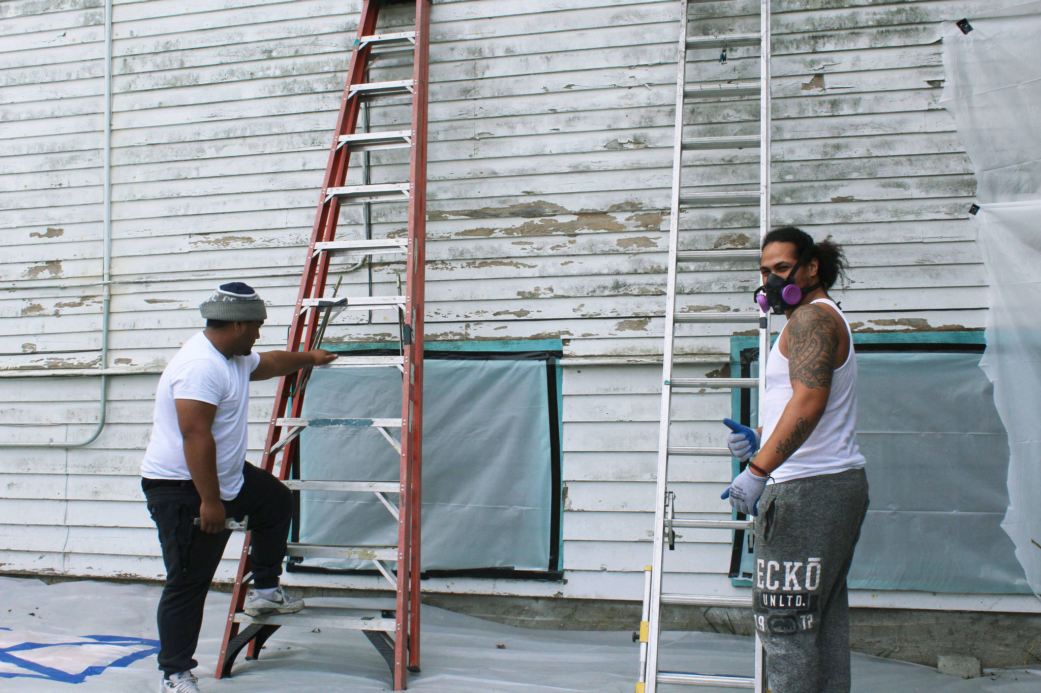 Workers Mason Tau, right, and Barry Brown, left, begin restoration project at Bayview Community Hall in Sept. 2019 after community meets its fundraising goal