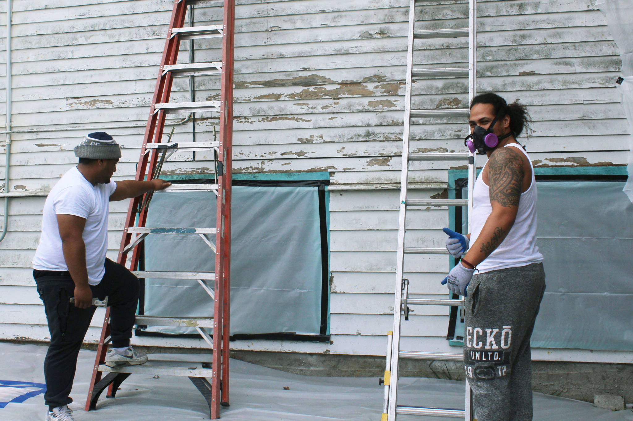 Workers Mason Tau, right, and Barry Brown, left, begin restoration project at Bayview Community Hall in Sept. 2019 after community meets its fundraising goal. Photo by Wendy Leigh/South Whidbey Record