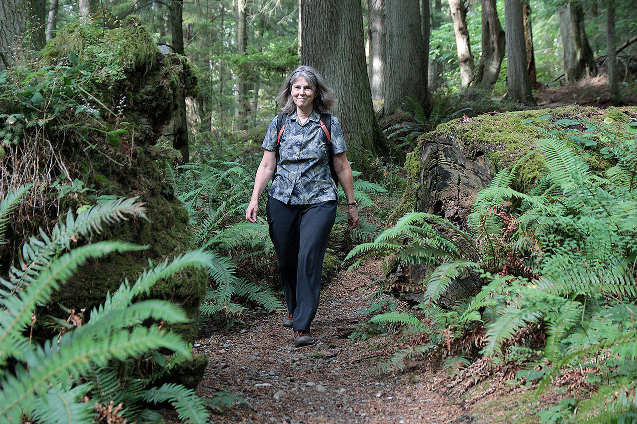 Maribeth Crandell walks a trail at South Whidbey State Park. The release party for her new book Hiking Close to Home will be held 4 p.m., Sept. 21 at Coupeville Library. Photos by Laura Guido/Whidbey News Group