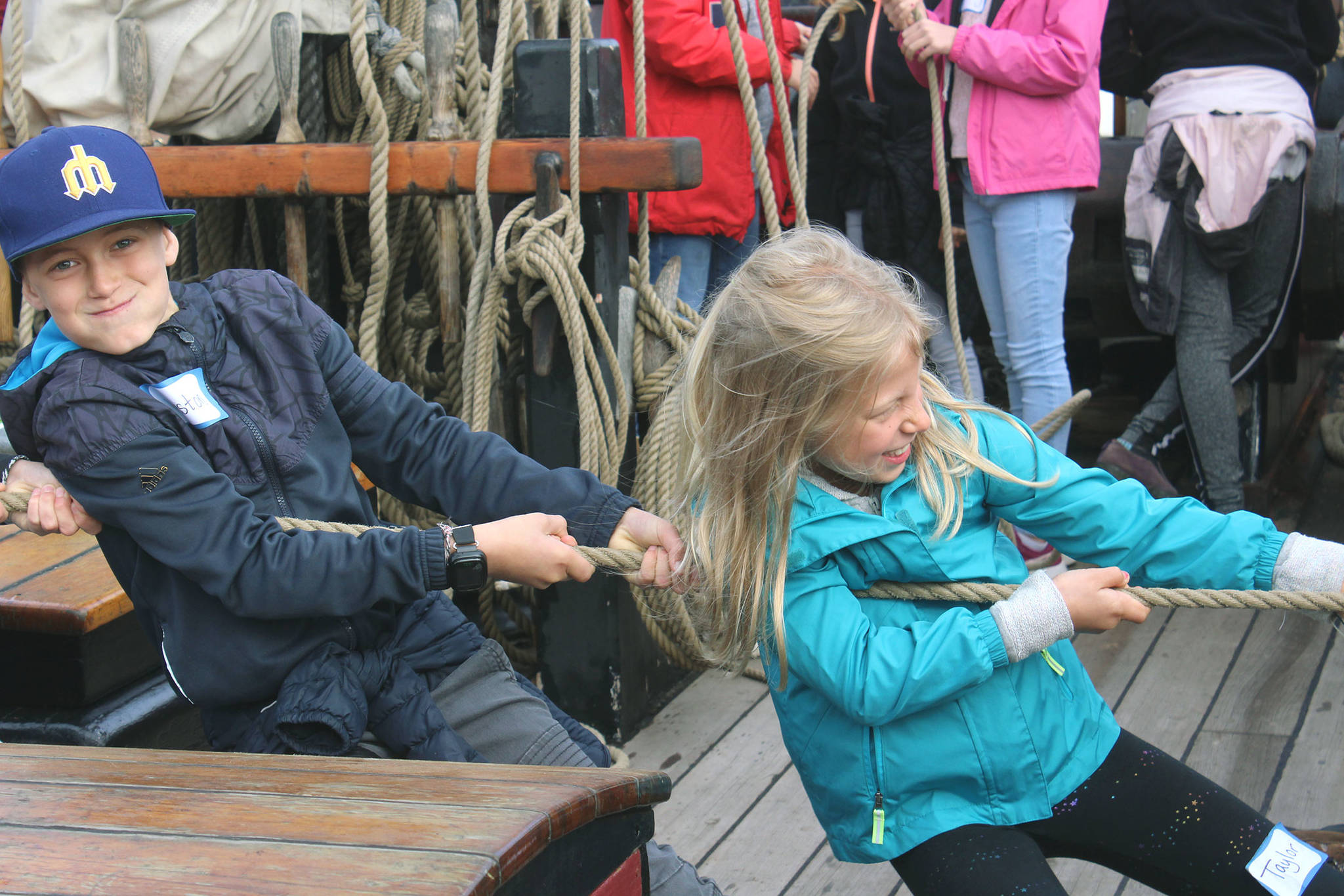 South Whidbey Elementary School students Weston Dill, right, and Taylor Jones, left, pull ropes aboard the Lady Washington historic “tall ship” in Langley harbor on Thursday. Photo by Wendy Leigh/South Whidbey Record