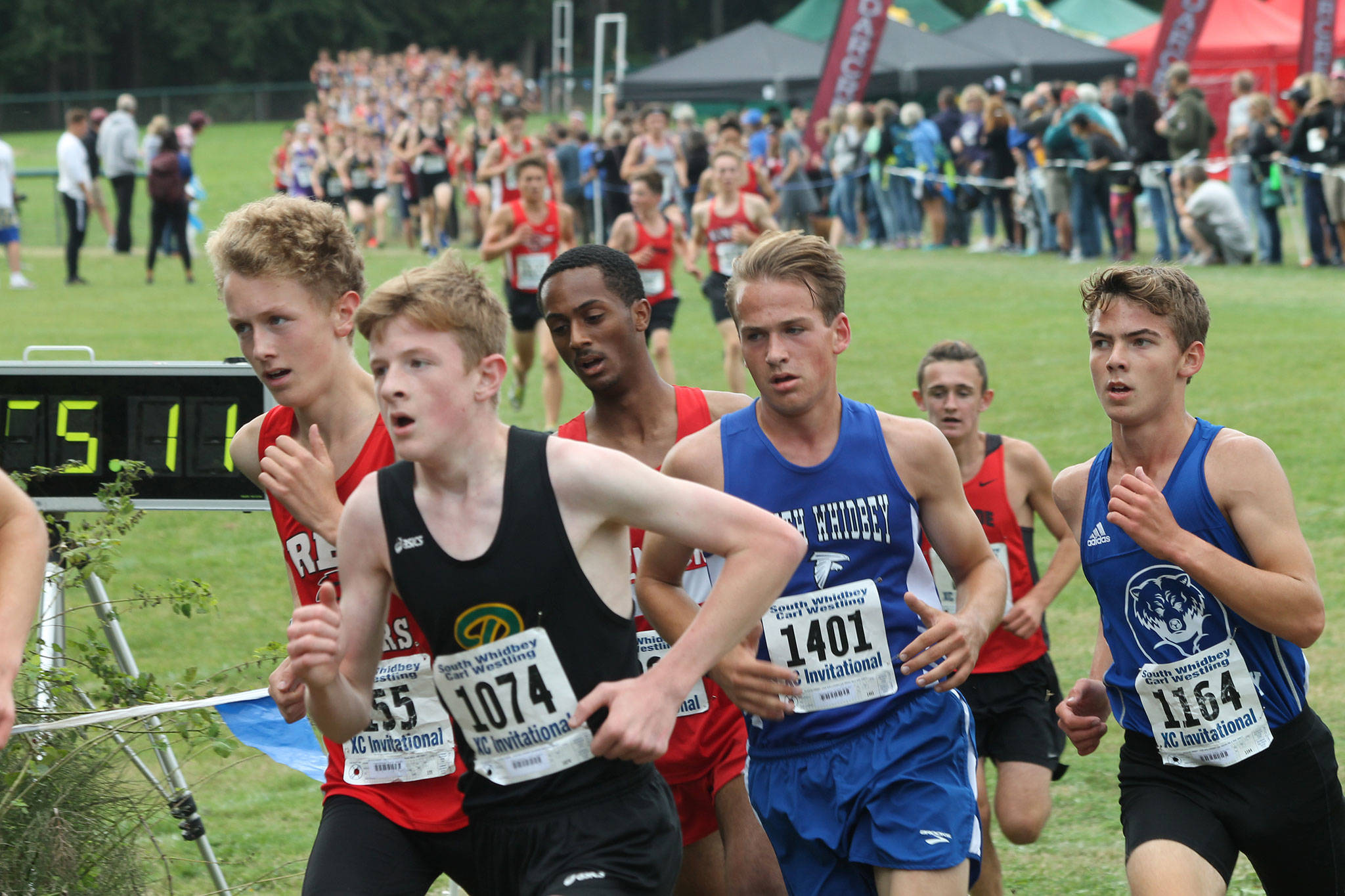 Michael Harwell (1401) runs with the lead pack.(Photo by Jim Waller/South Whidbey Record)