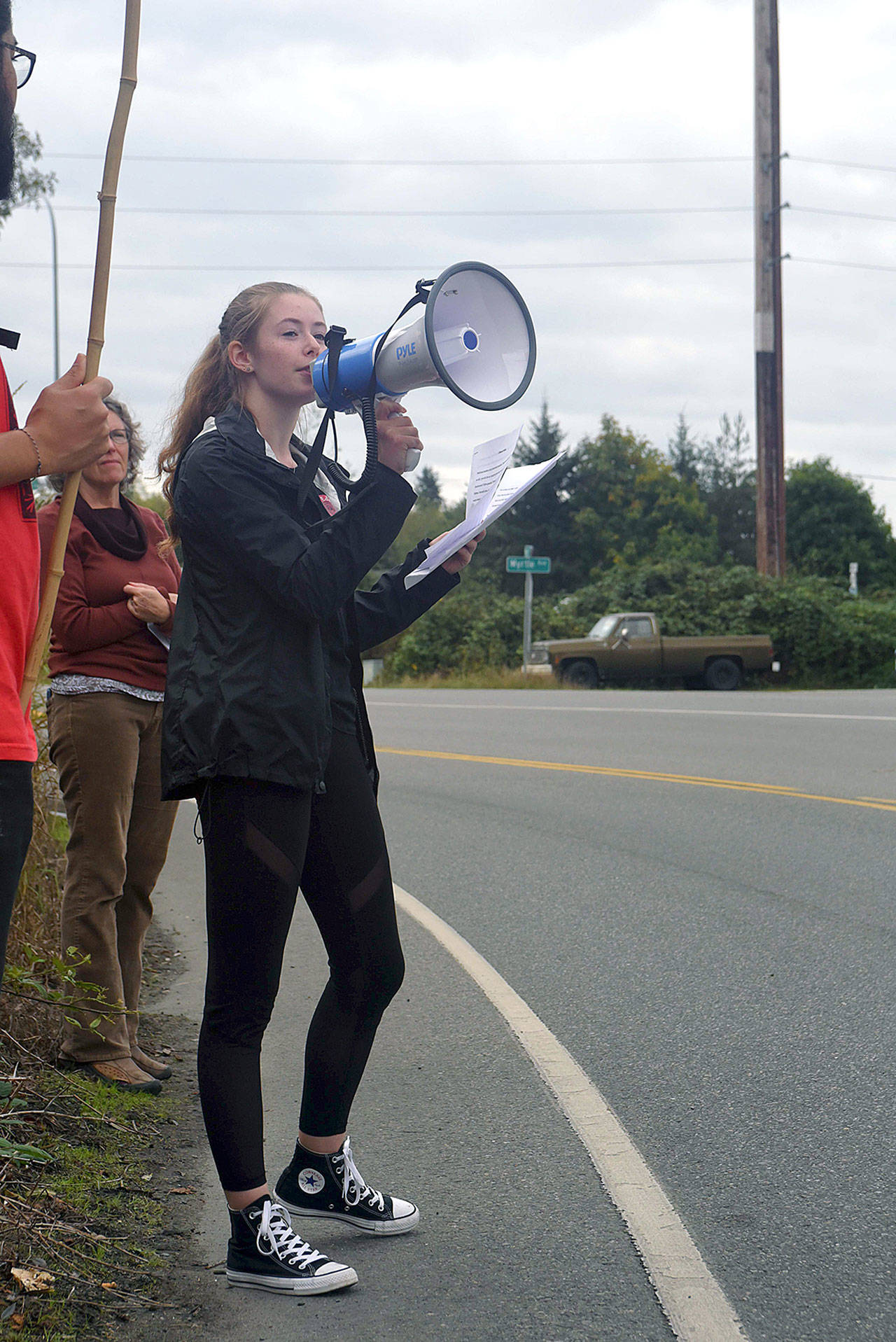 South Whidbey High School sophomore Annie Philp, one of the organizers, speaks at a climate change protest Friday.