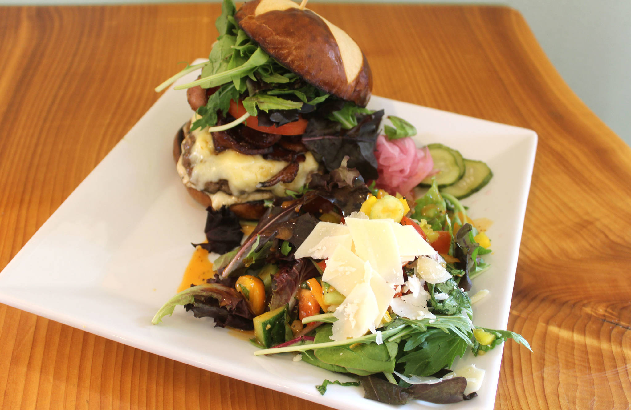The 5511 Bistro at Blooms Winery dishes out Three Sisters Beef burgers and island fresh salads from local farms. Tables are handmade by winery owner Ken Bloom. Photo by Wendy Leigh/South Whidbey Record