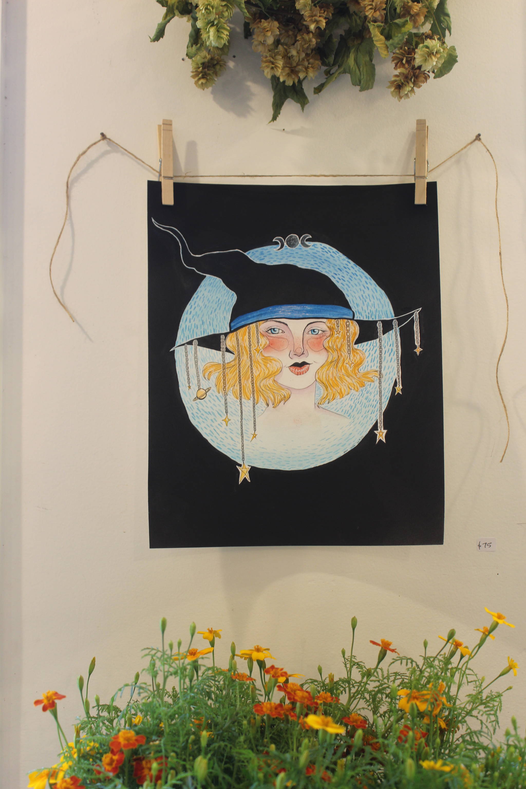 The “Salish Sea Sorceress” painting dangles its magic at the “Witches of Whidbey” art show on 1st Street in Langley.                                The “Salish Sea Sorceress” painting dangles its magic at the “Witches of Whidbey” art show on 1st Street in Langley.