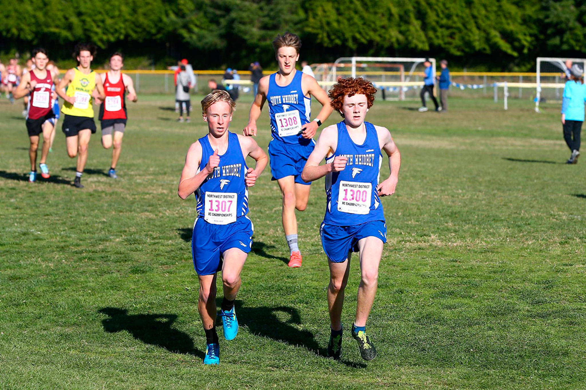 Thomas Simms, left, Cooper Ullman, back, and Aidan Donnelly run together in the district meet Saturday.(Photo by John Fisken)