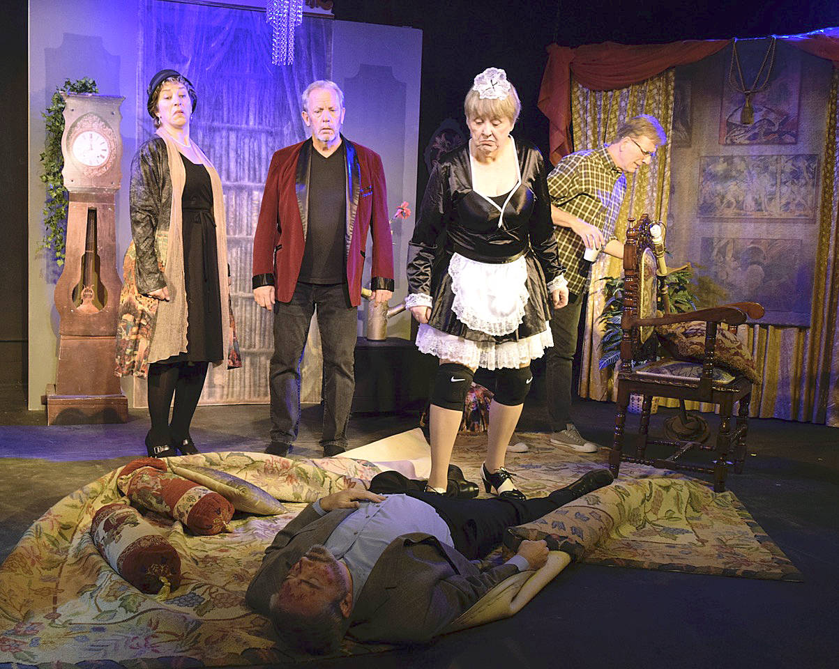 During Outcast’s production of “Over My Dead Body,” bodies pile up as two actors, including Ken Stephens, vie to be the corpse in a community theater play. Looking on are Christina Parker, left, Jim Carroll, Kathryn Sandy O’Brien and Ned Farley, right. Photos by Patricia Guthrie