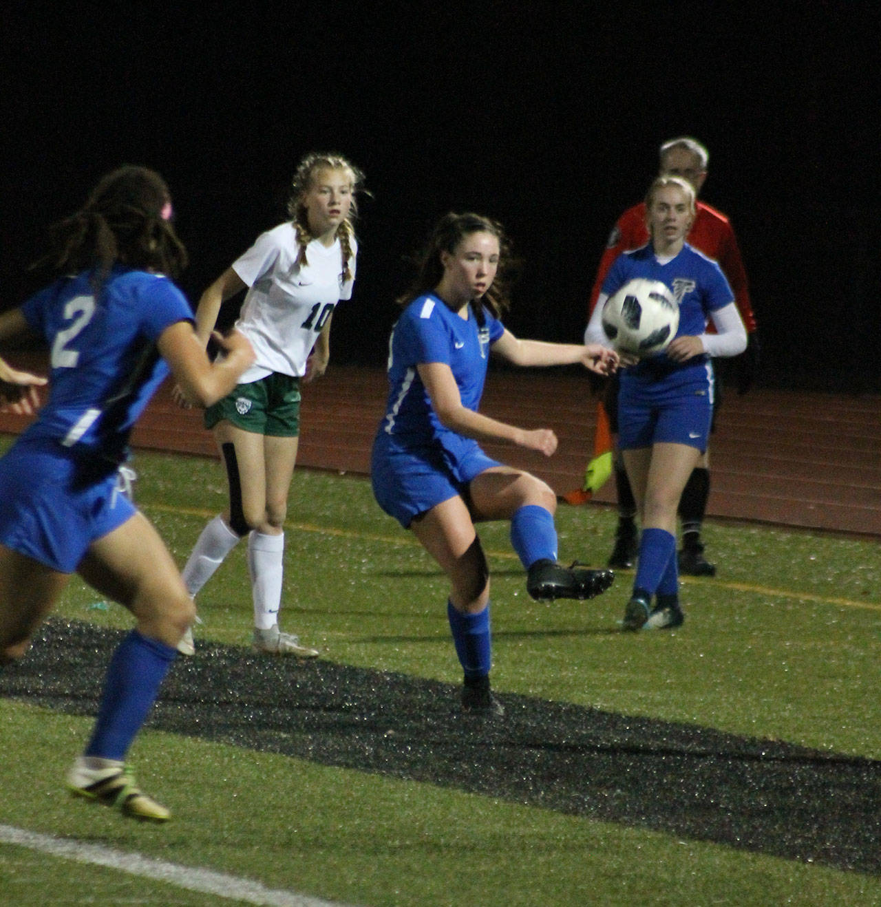 Kelly Murnane advances the ball for the Falcons. (Photo by Jim Waller/South Whidbey Record)