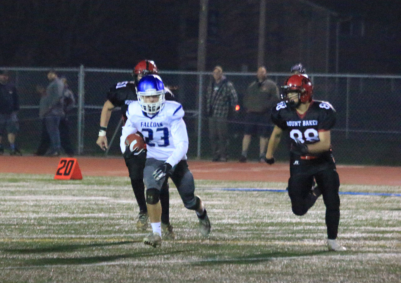 Ryan Morgan (23) looks for running room on a kickoff return.(Photo by Jim Waller/South Whidbey Record)
