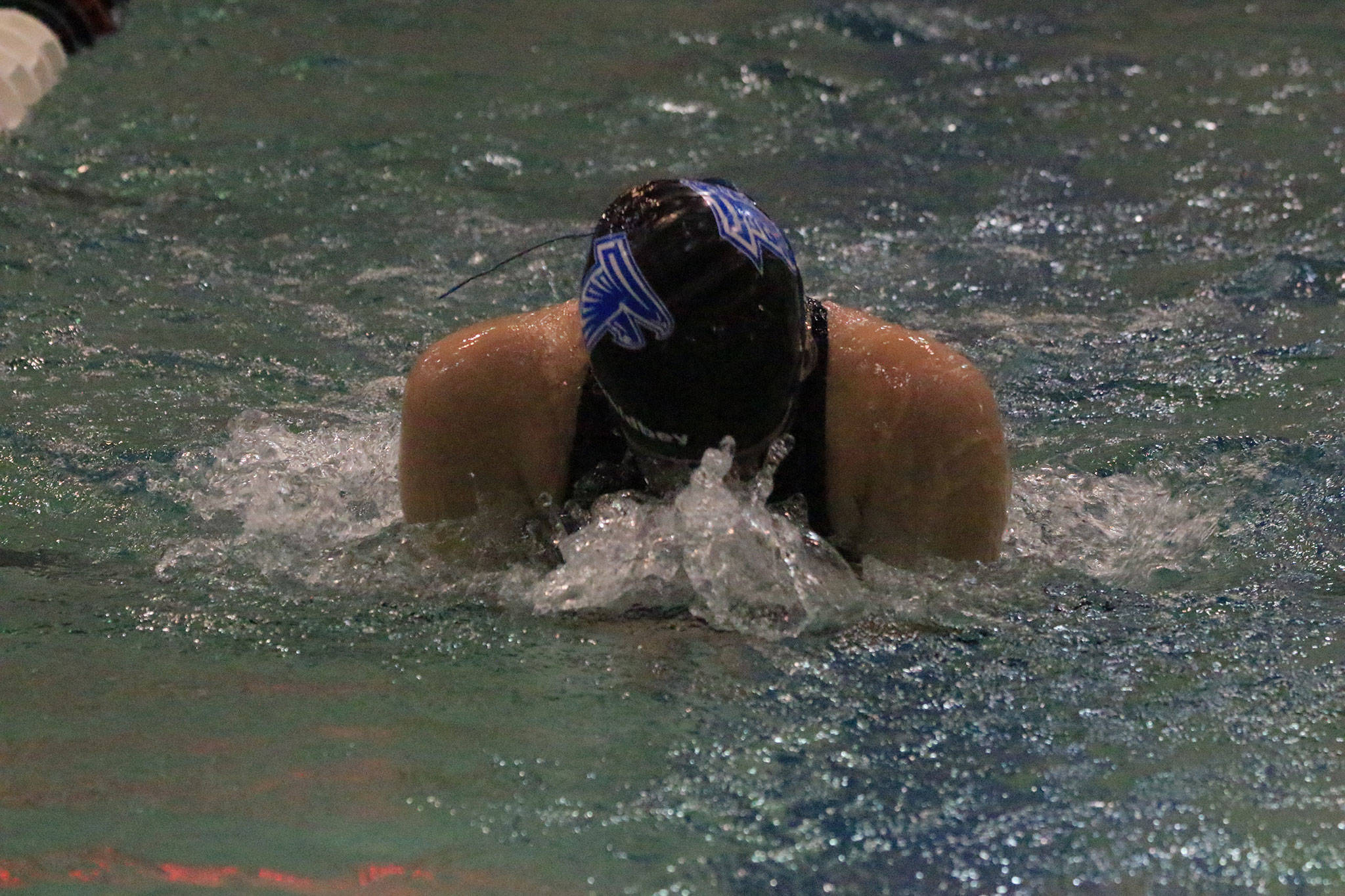 Sarah Zundel swims the breaststroke in the medley relay finals.(Photo by Jim Waller/South Whidbey Record)