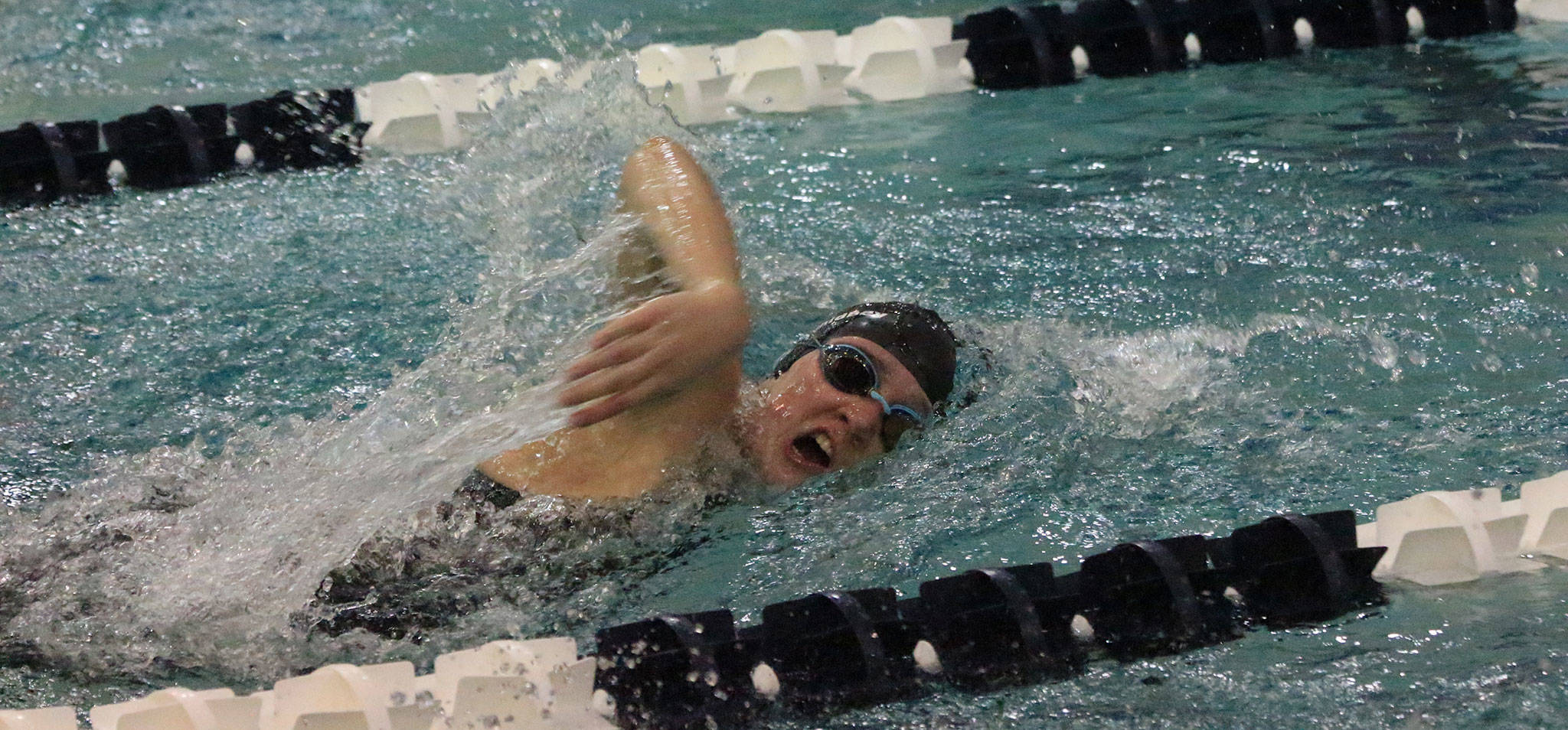 South Whidbey’s Ashley Lynch swims to a state berth in the 200-yard freestyle in the district finals Saturday.(Photo by Jim Waller/South Whidbey Record)