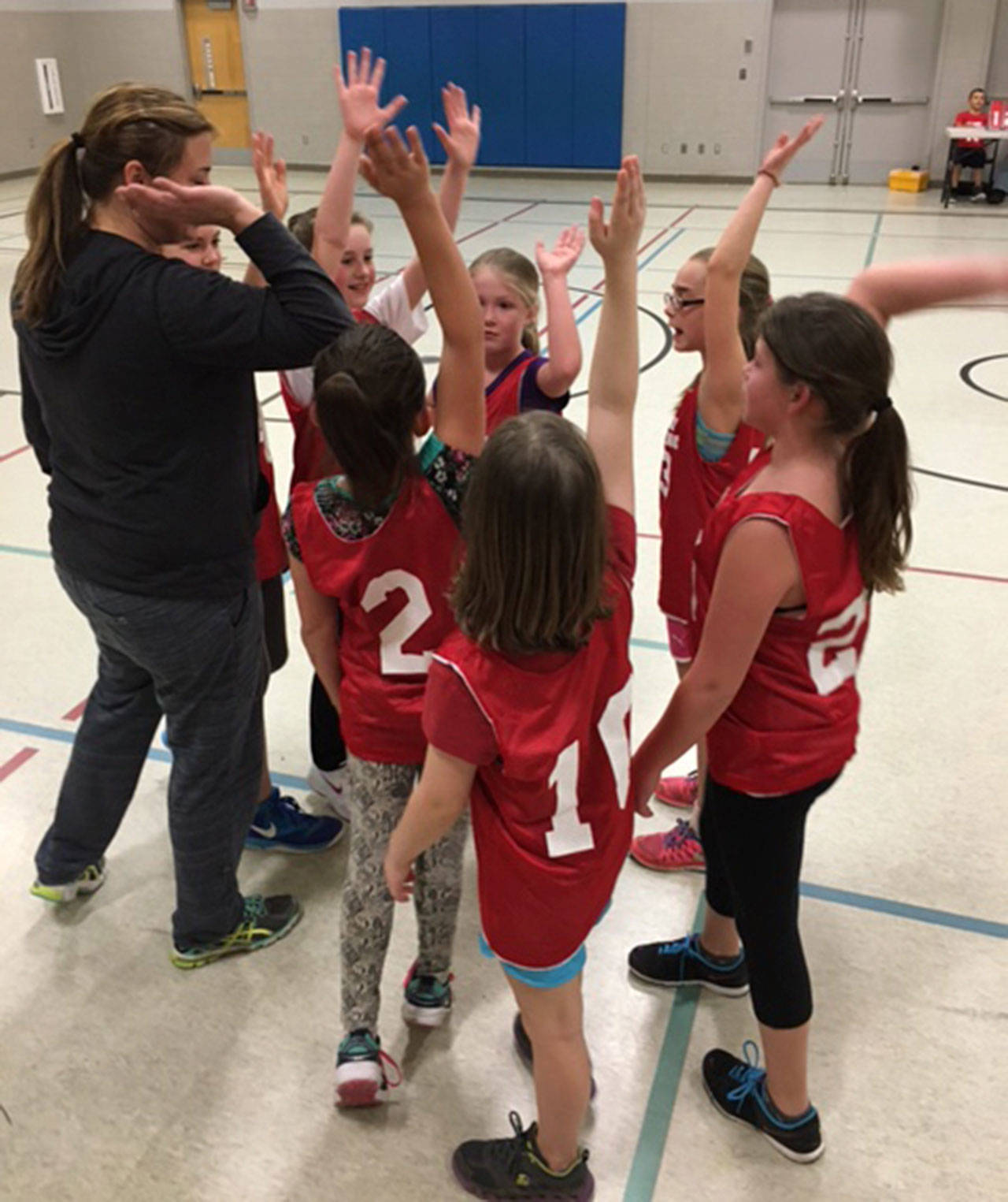 A group of youngster get ready to begin a game in a past season. Registration of the 2020 youth basketball season is now underway. (Photo by Carrie Monforte)