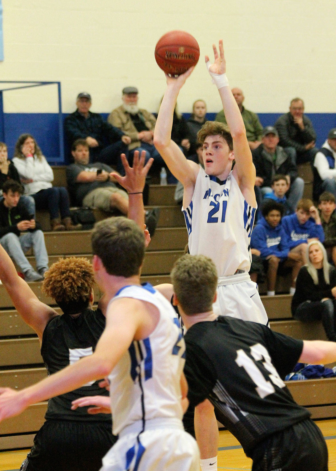 Carson Wrightson (21) was a second-team, all-conference player for the Falcons last winter. (Photo by Jim Waller/South Whidbey Record)