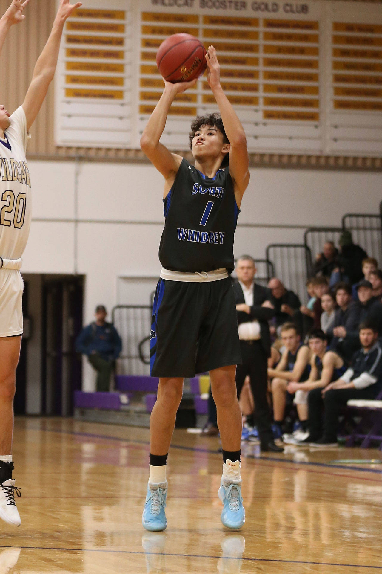 Jacob Ng launches a three-pointer for the Falcons.(Photo by John Fisken)