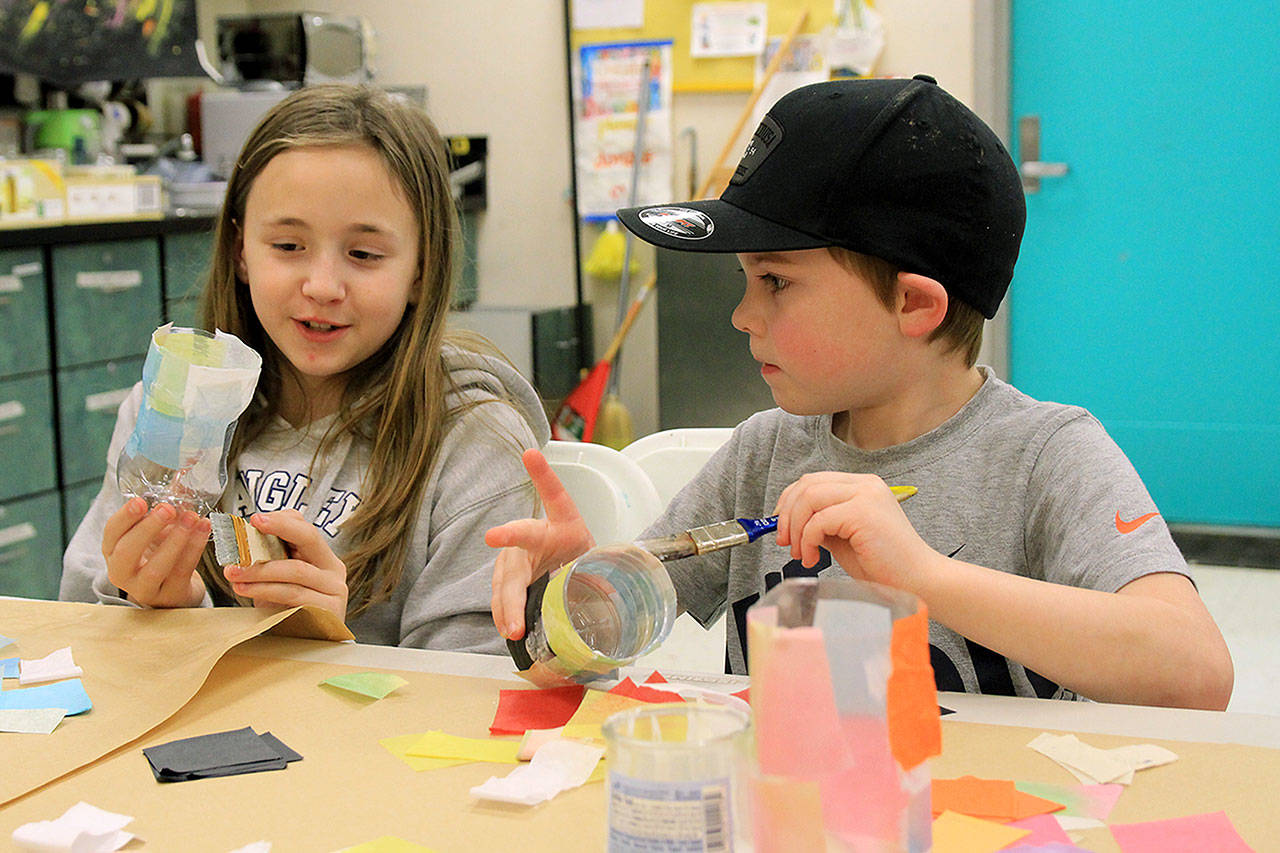 Photo by Kira Erickson / South Whidbey Record                                Cousins Kailea Bravo and Kamdin Hill make lanterns for the parade.