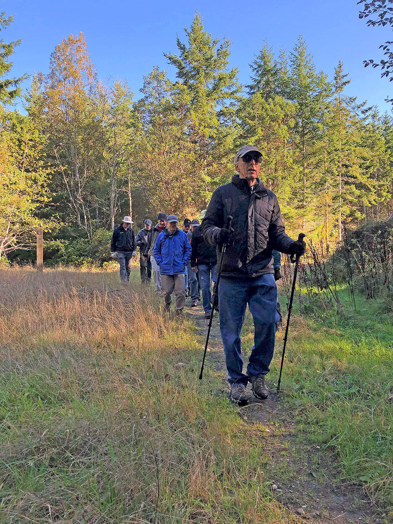 Photo courtesy of Whidbey Camano Land Trust                                Paul Goldfinger leads the Sons of the Beach on a hiking of Trillium Community Forest in October.