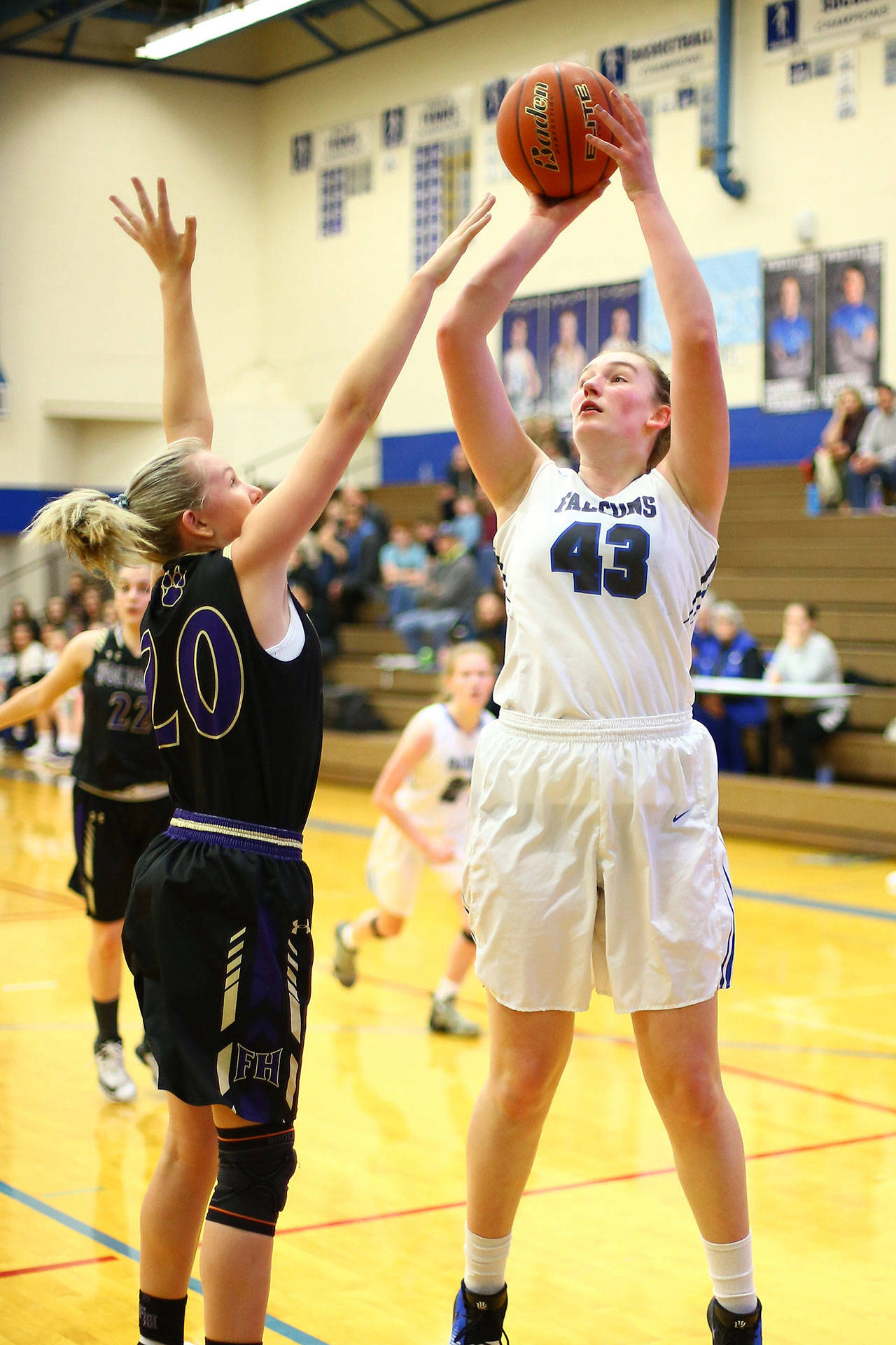 Isabell Wood, right, shoots over Friday Harbor’s Ashley Lawson.(Photo by John Fisken)
