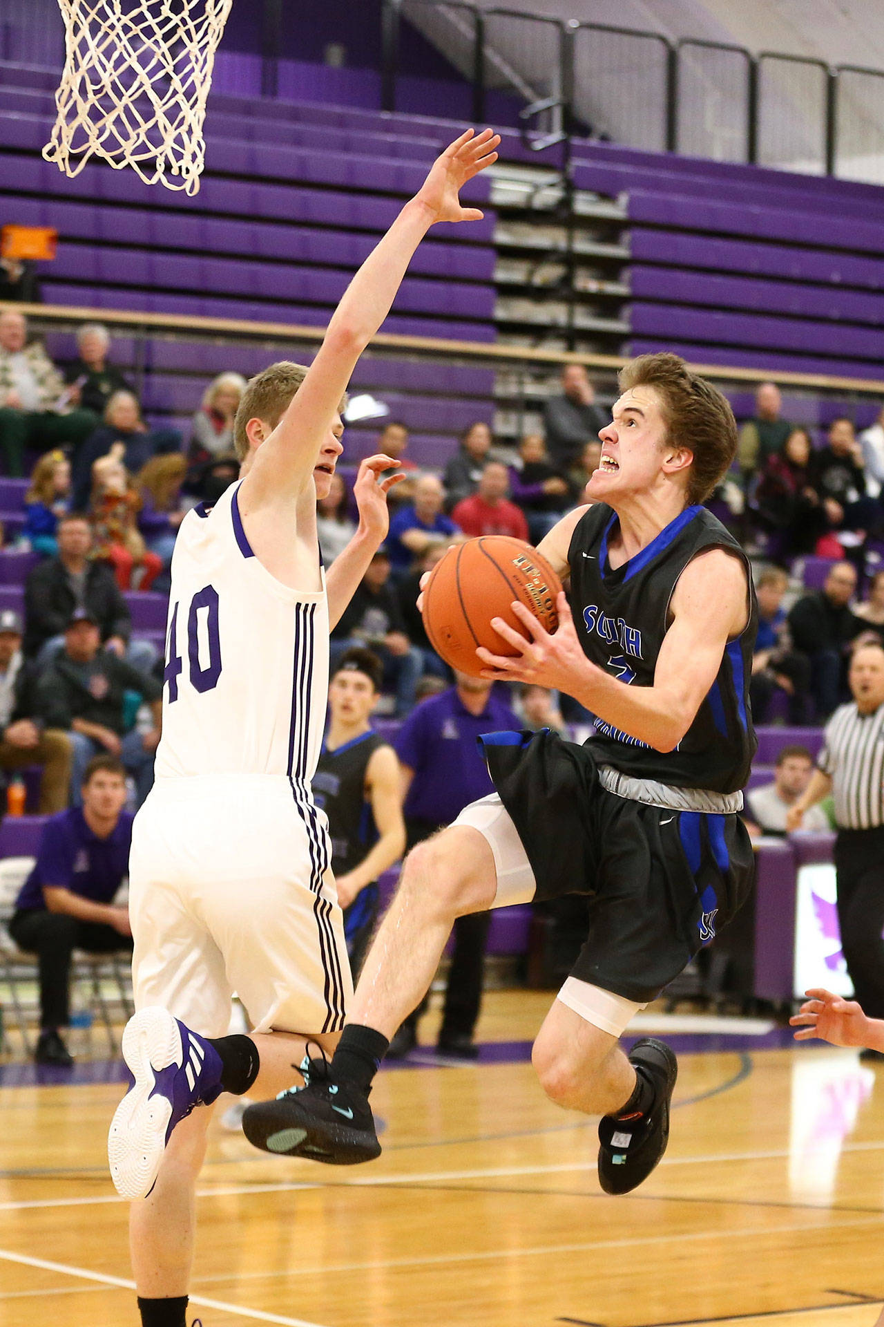 Nick Young attacks the basket for South Whidbey.(Photo by John Fisken)