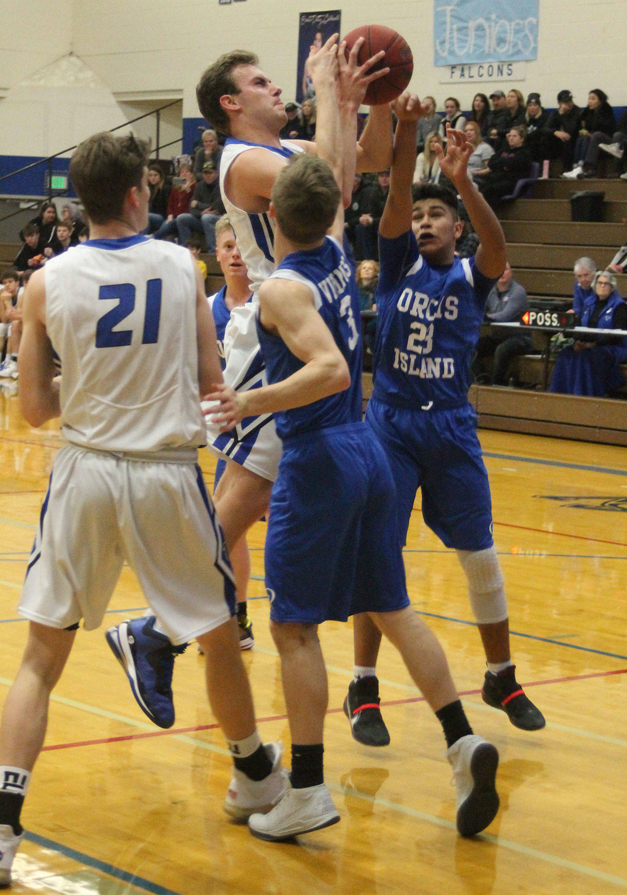 Levi Buck is fouled as he powers to the hoop. (Photo by Jim Waller/South Whidbey Record)