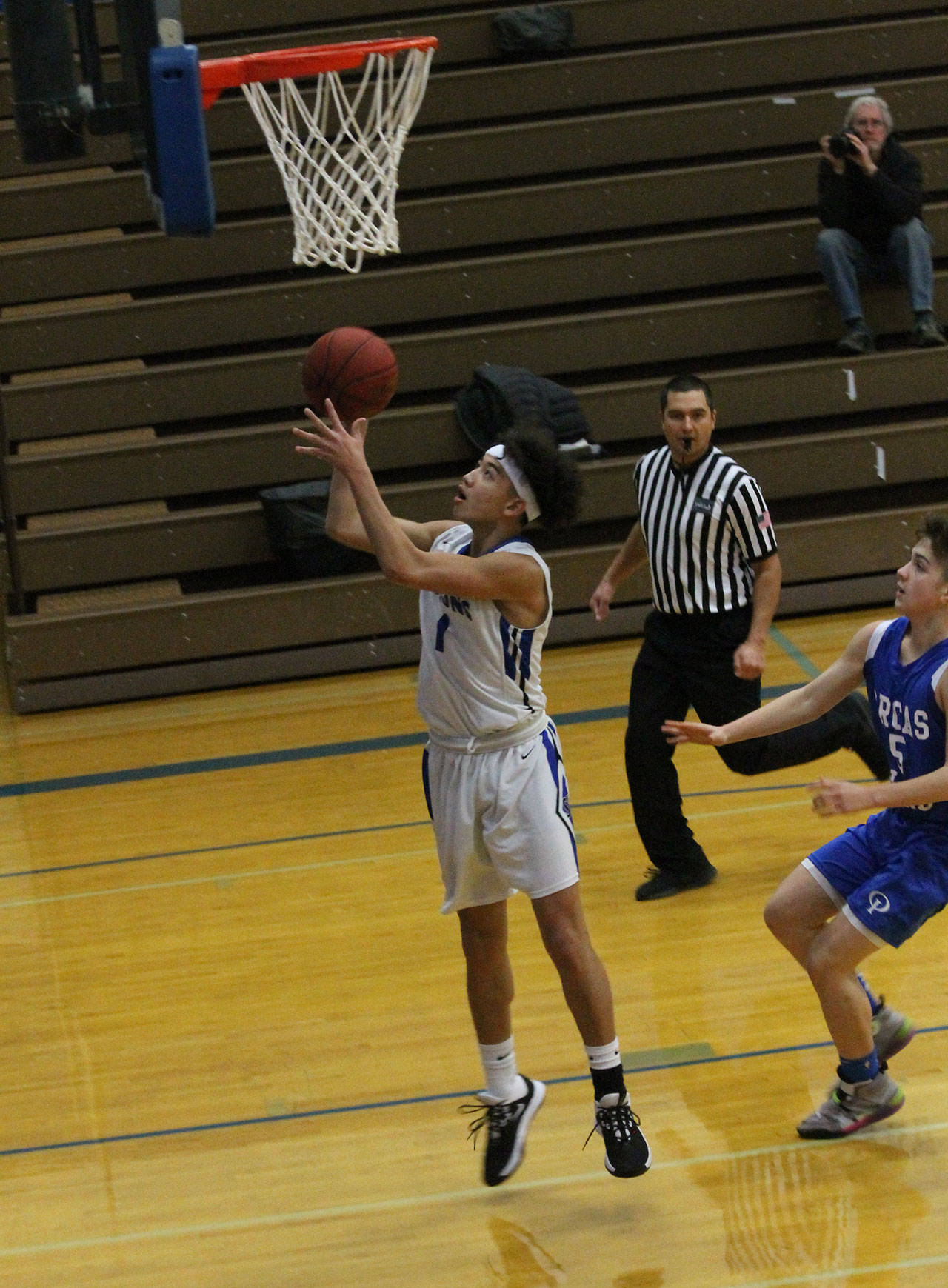 Jacob Ng finishes off a fast break.(Photo by Jim Waller/South Whidbey Record)