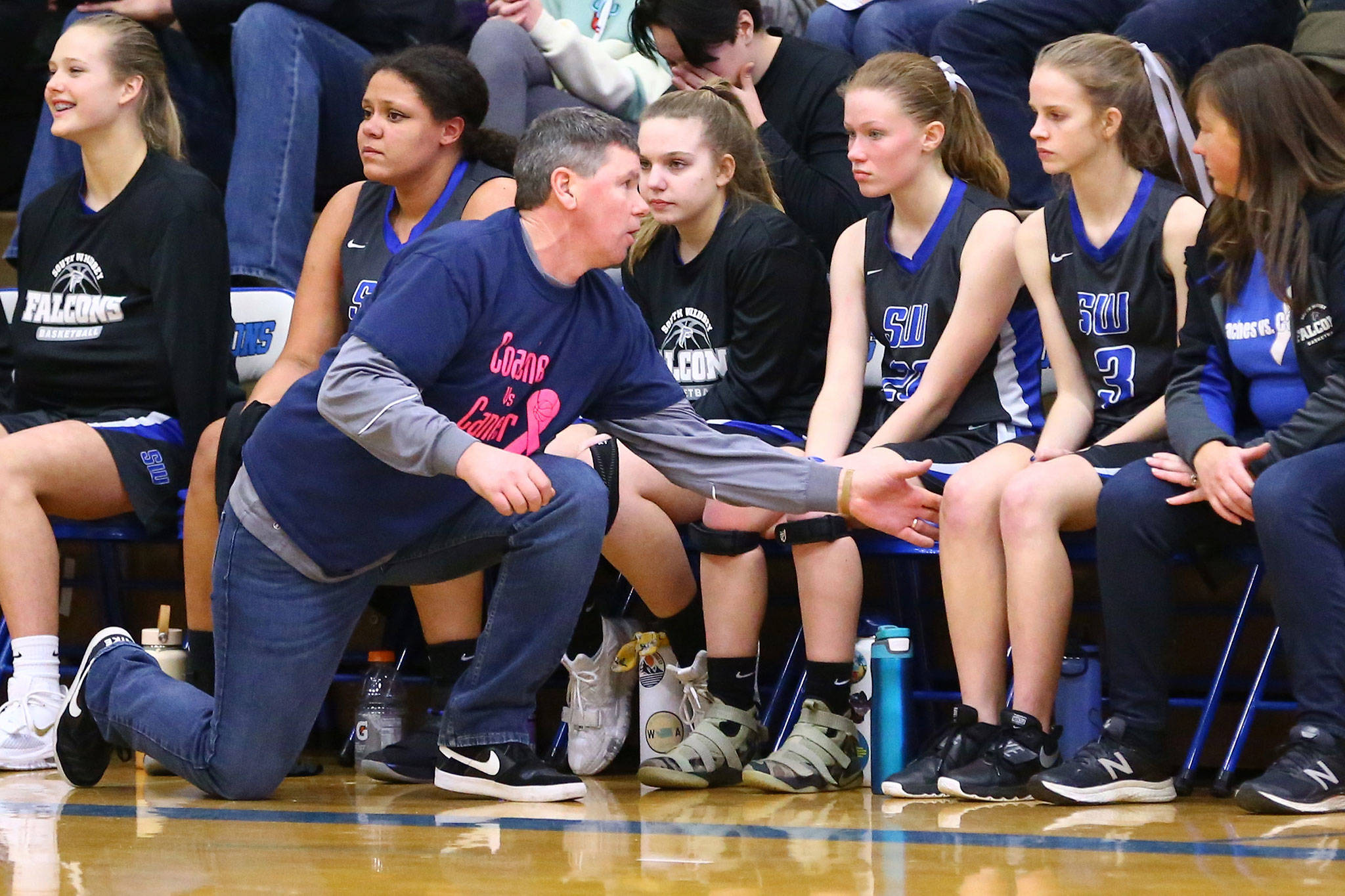 South Whidbey coach Jeff Hanson discusses the Coupeville game with Mary Moss (3).(Photo by John Fisken)