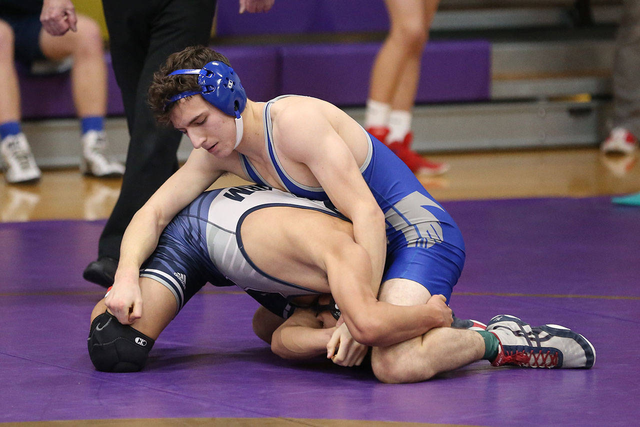 Sawyer Mauk, top, tangles with his opponent Saturday.(Photo by John Fisken)