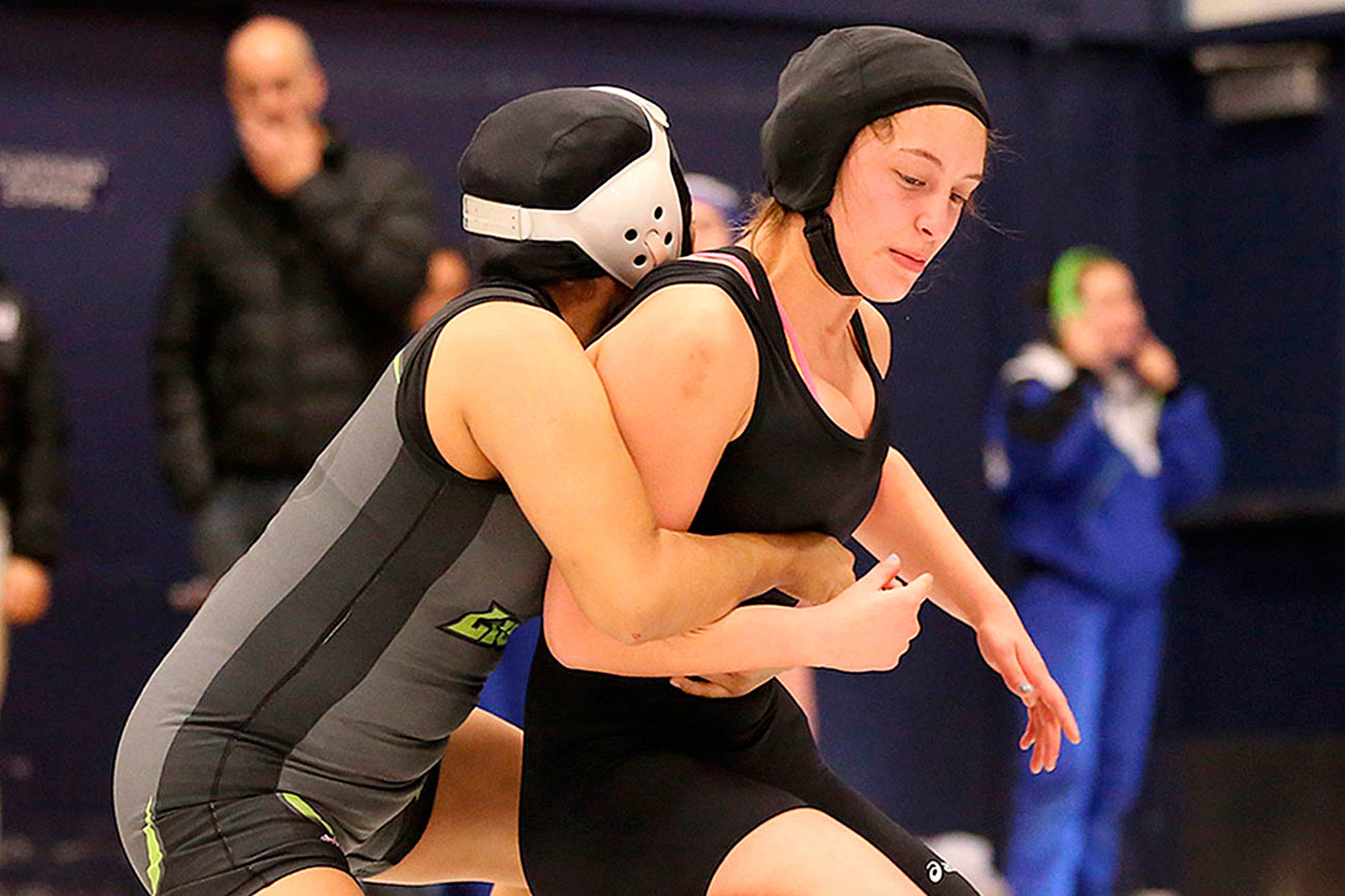 South Whidbey’s Nicole Helseth, right, wrestles in the Kamiak tournament last year. This weekend she and the other Falcon wrestlers will compete in the sub-regional meets. (Photo by John Fisken)