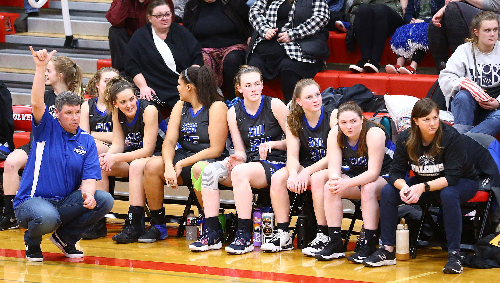 South Whidbey coach Jeff Hanson signals a play during Tuesdays game at Coupeville. (Photo by John Fisken)