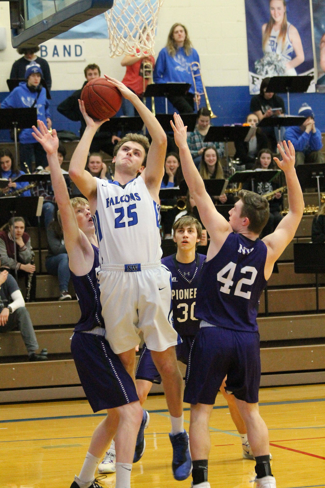 Levi Buck powers to the hoop for the Falcons. (Photo by Jim Waller/South Whidbey Record)