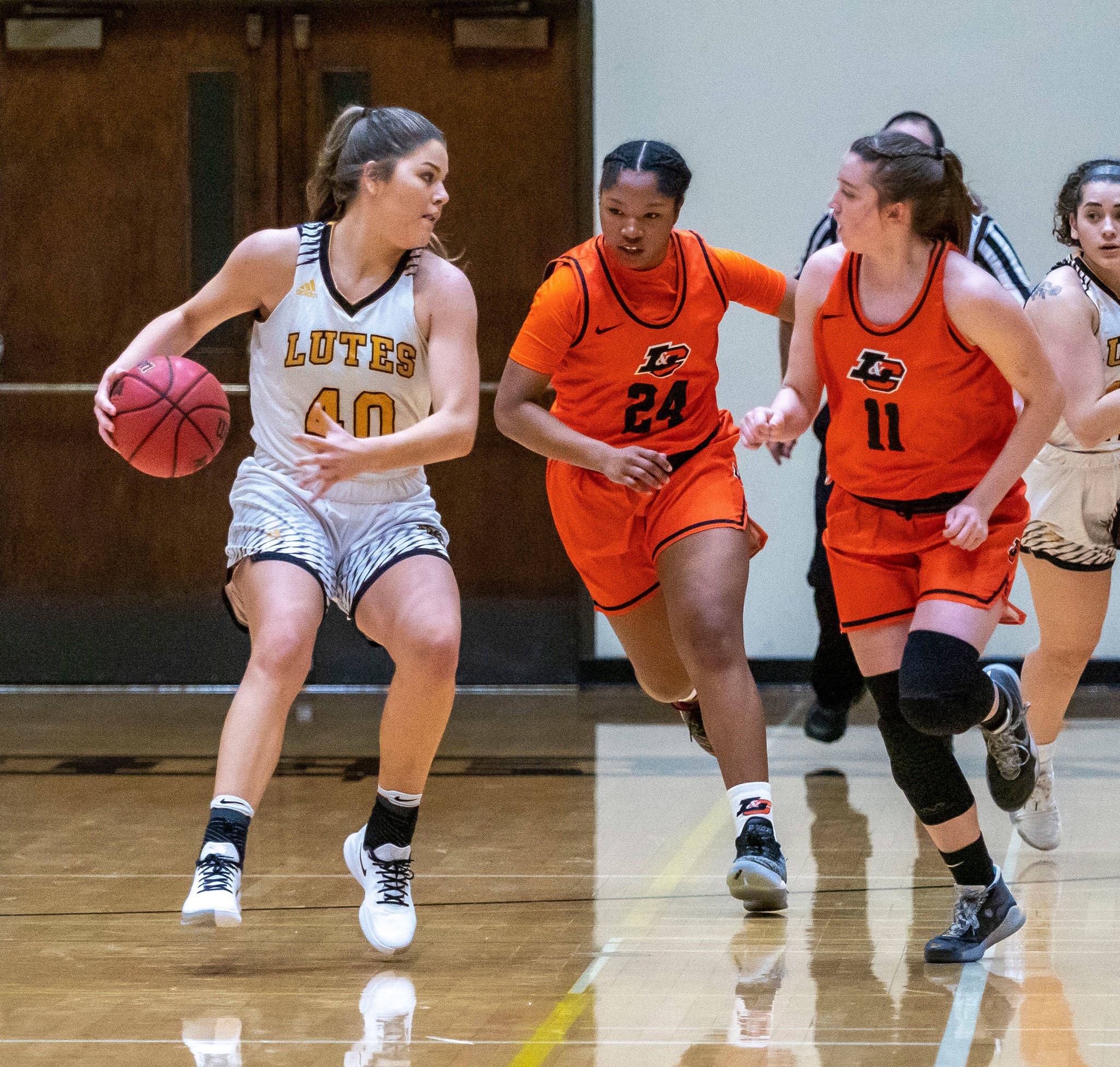 South Whidbey graduate Megan Drake, left, was one of the top shooters on the Pacific Lutheran women’s basketball team this season. (Photo courtesy of PLU Athletics)