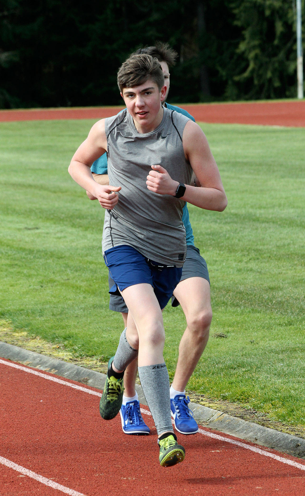 Luc Gandarias heads up the back stretch in the 1,600 meters. (Photo by Jim Waller/South Whidbey Record)