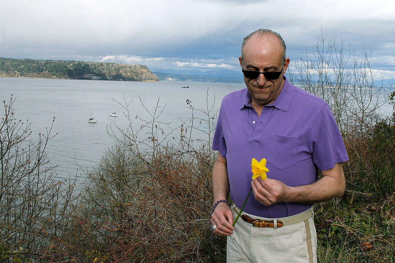 Photo by Kira Erickson/Whidbey News Group                                Langley resident Charles LaFond often ponders life and death on the grassy patch across the street from Whidbey Island Center for the Arts and next door to Healing Circles.