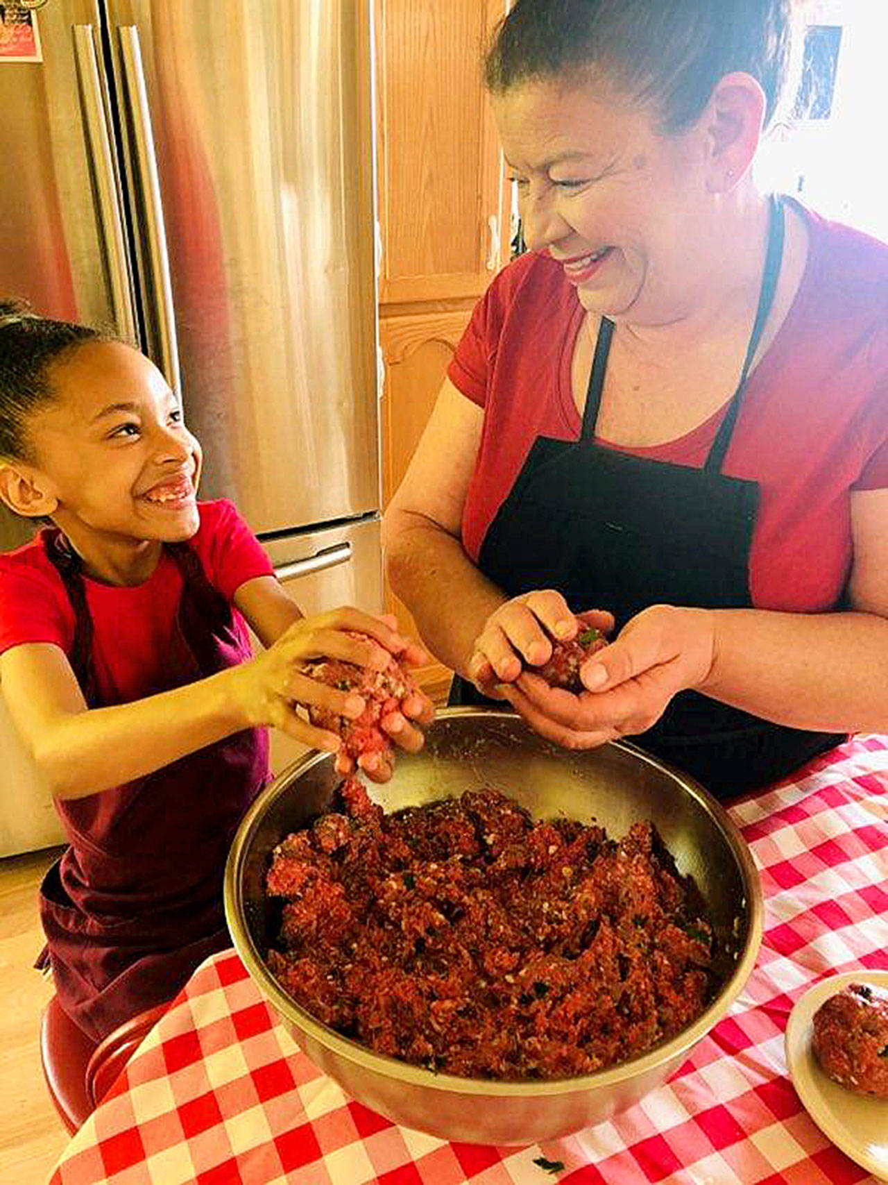 Photo provided                                Auntie Jackie Huerta often has her 8-year-old granddaughter, Naomi Jean, to help her in the kitchen.