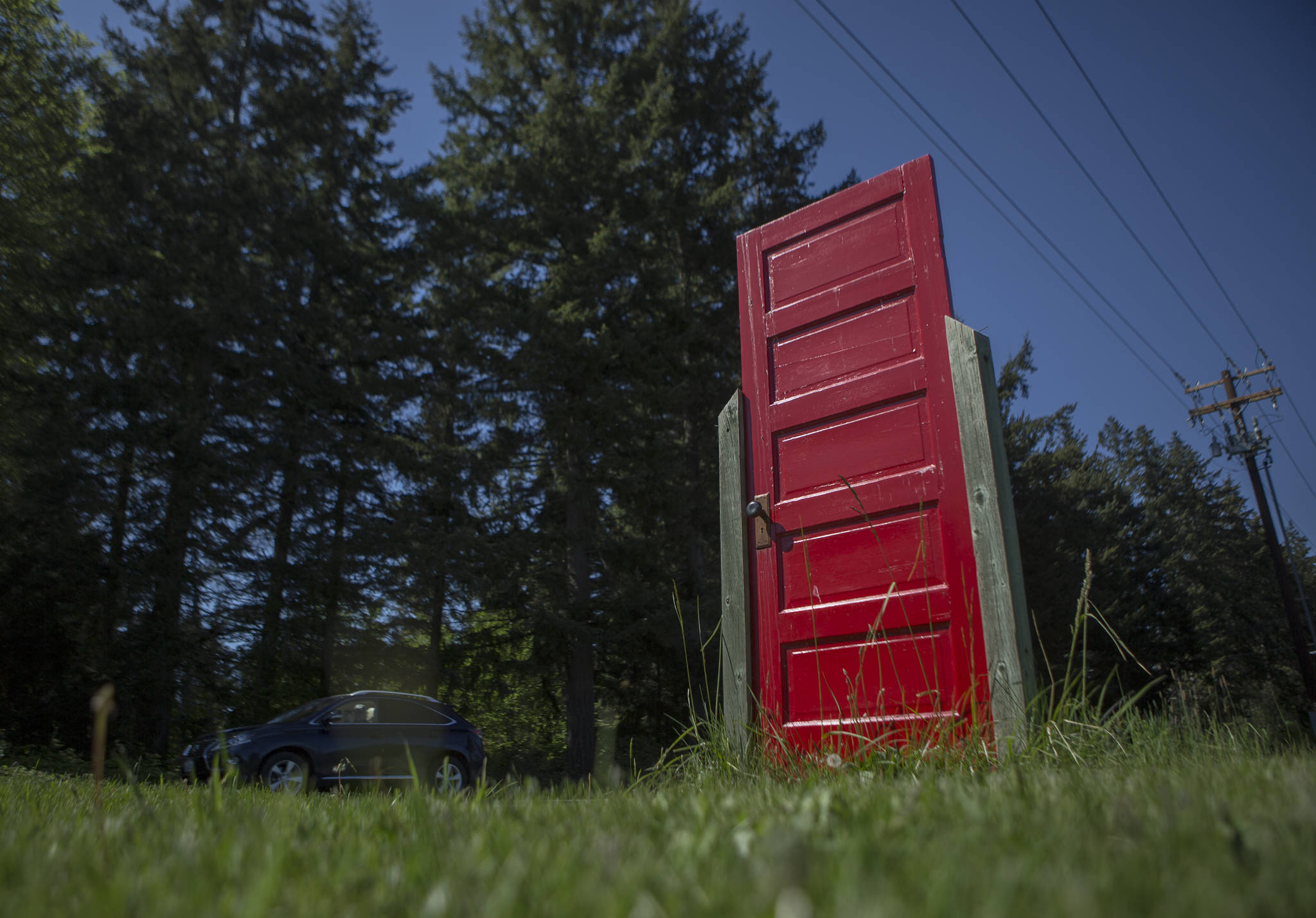 A red door along Cultus Bay Road in Clinton on Whidbey Island. (Olivia Vanni / The Herald)