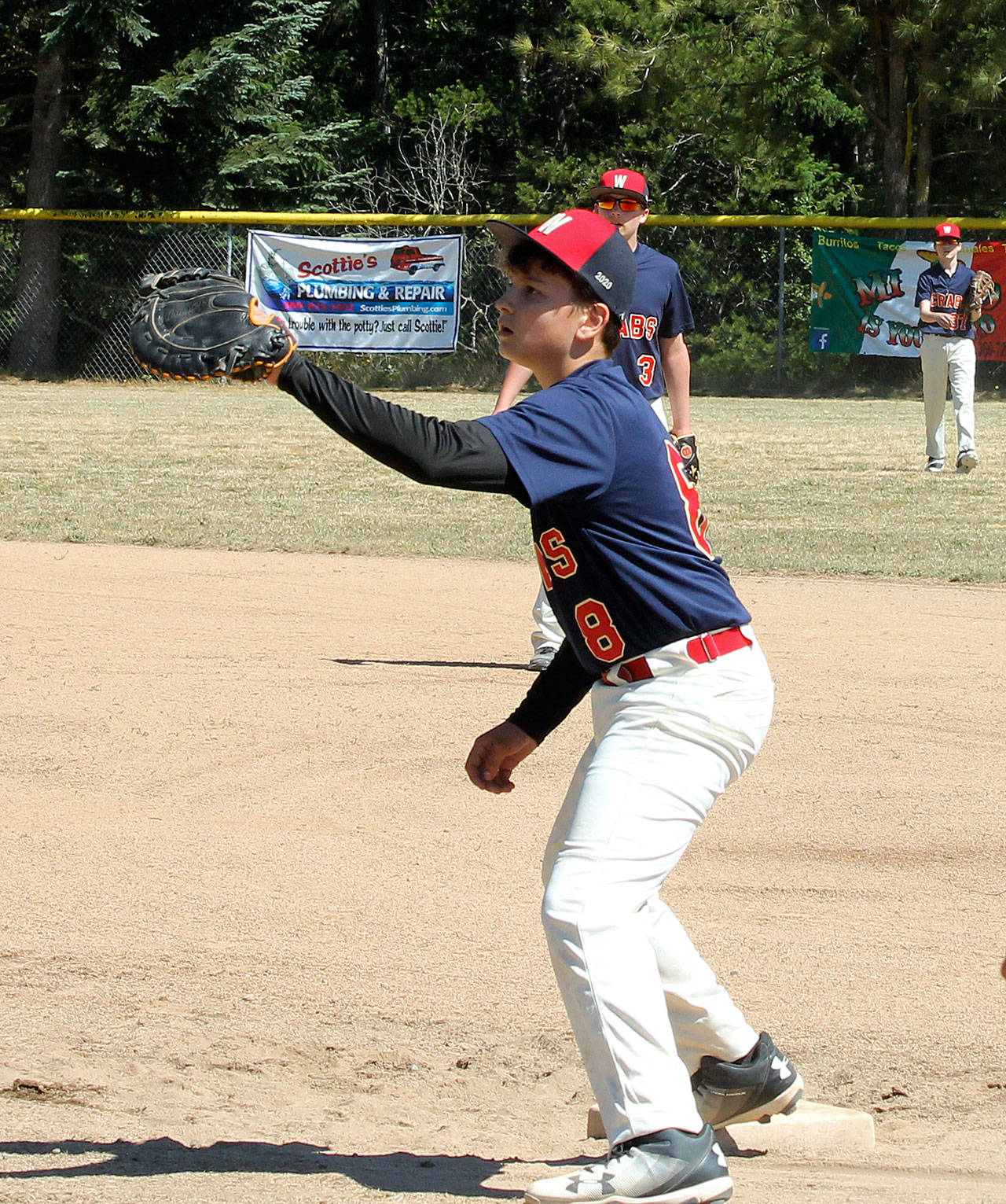 First baseman Kasen Parcell awaits a throw Saturday.(Photo by Jim Waller/South Whidbey Record)