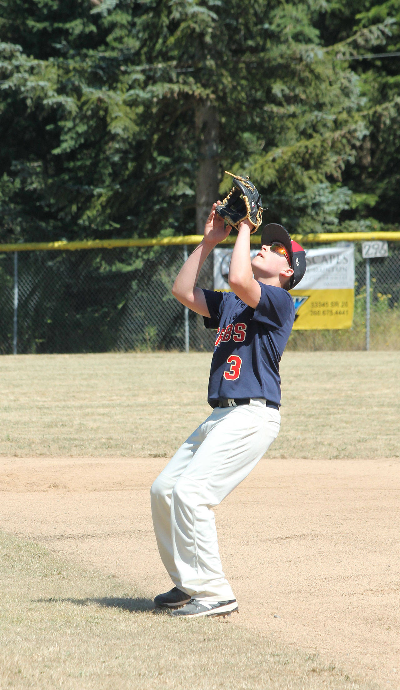 South Whidbey second baseman Liam Petty settles under a pop-up. (Photo by Jim Waller/South Whidbey Record)
